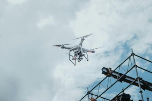 a drone hovering over an industrial region.